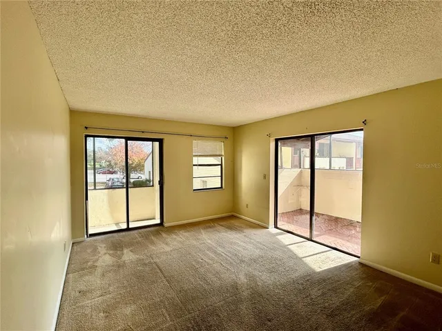 an empty room with closet and wooden floor