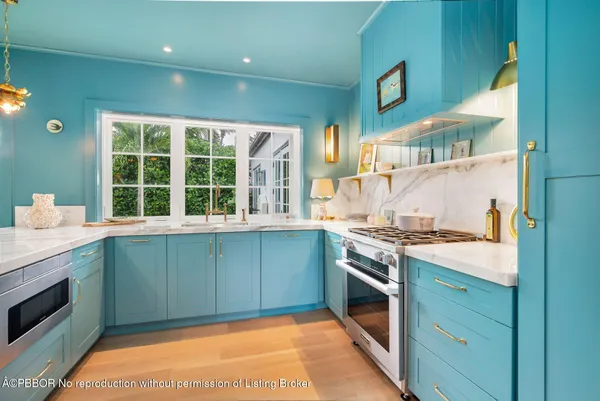 a kitchen with a stove and a sink