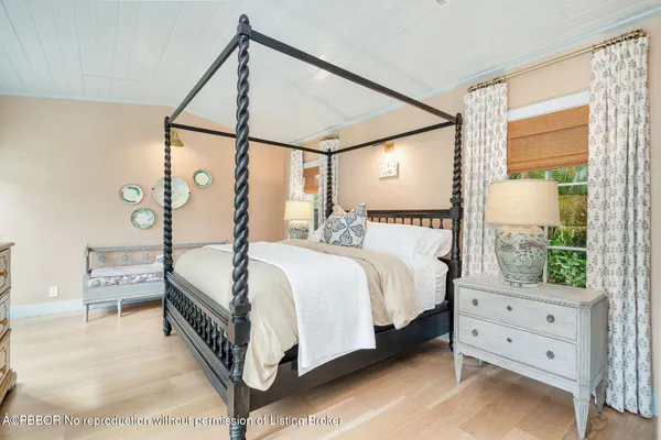 a bed room with a bed and a dresser