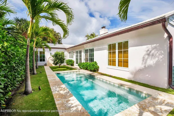 a view of swimming pool with a backyard