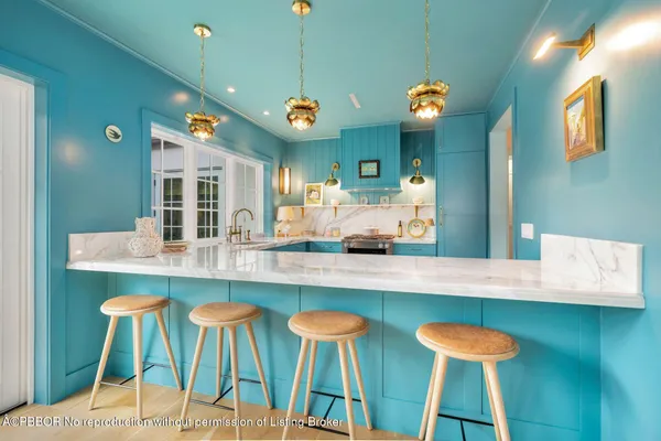 a large kitchen with a table and chairs