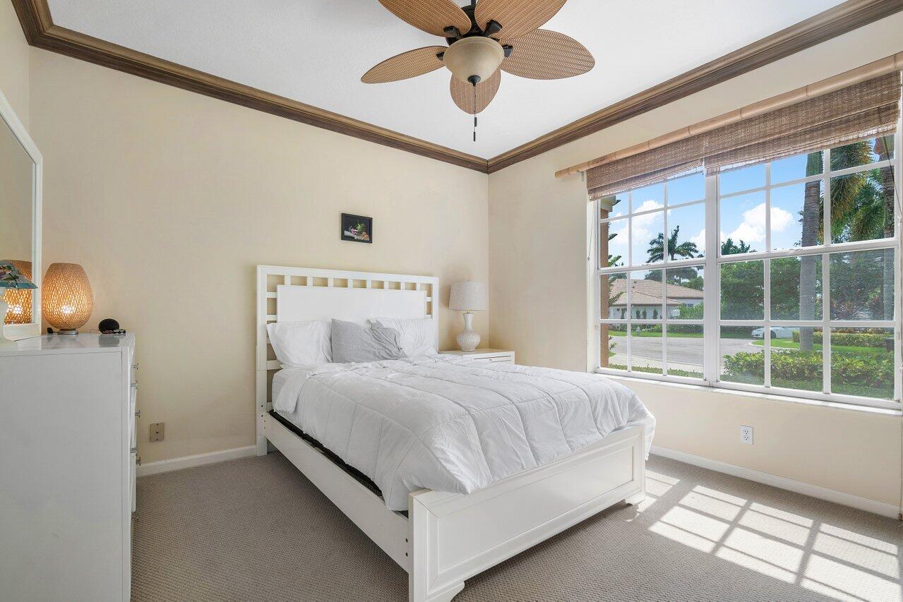 8161 Quail Meadow Way West Palm Beach, FL 33412 - Photo 16 of 36 a bedroom with a bed and window