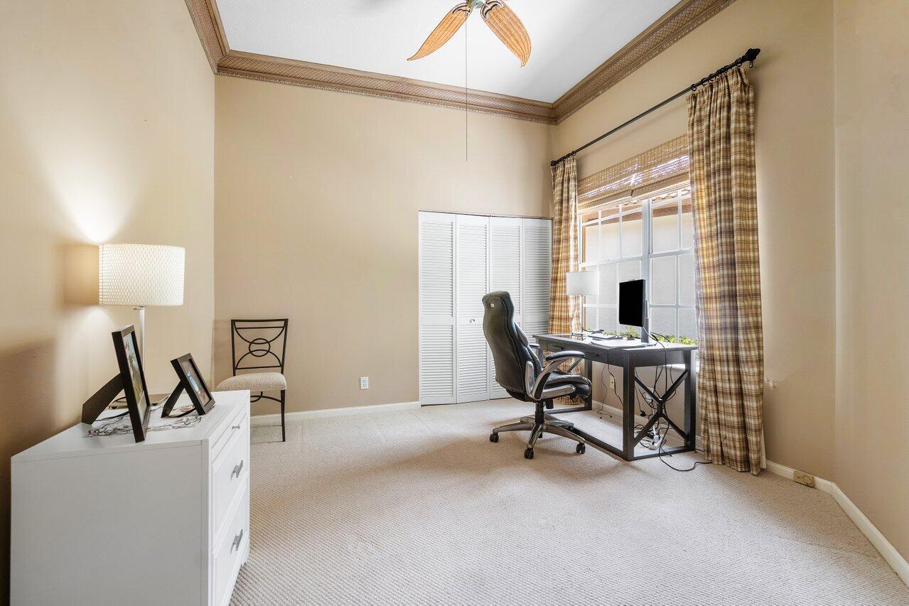 8161 Quail Meadow Way West Palm Beach, FL 33412 - Photo 17 of 36 a work room with furniture and a window