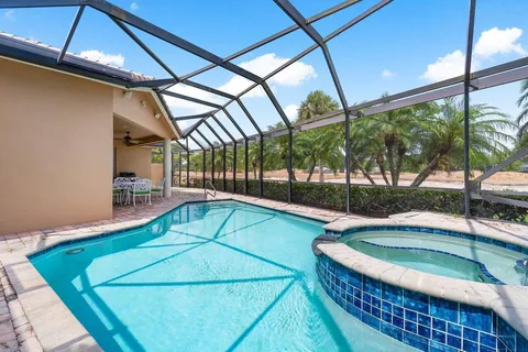 a view of a swimming pool with a patio
