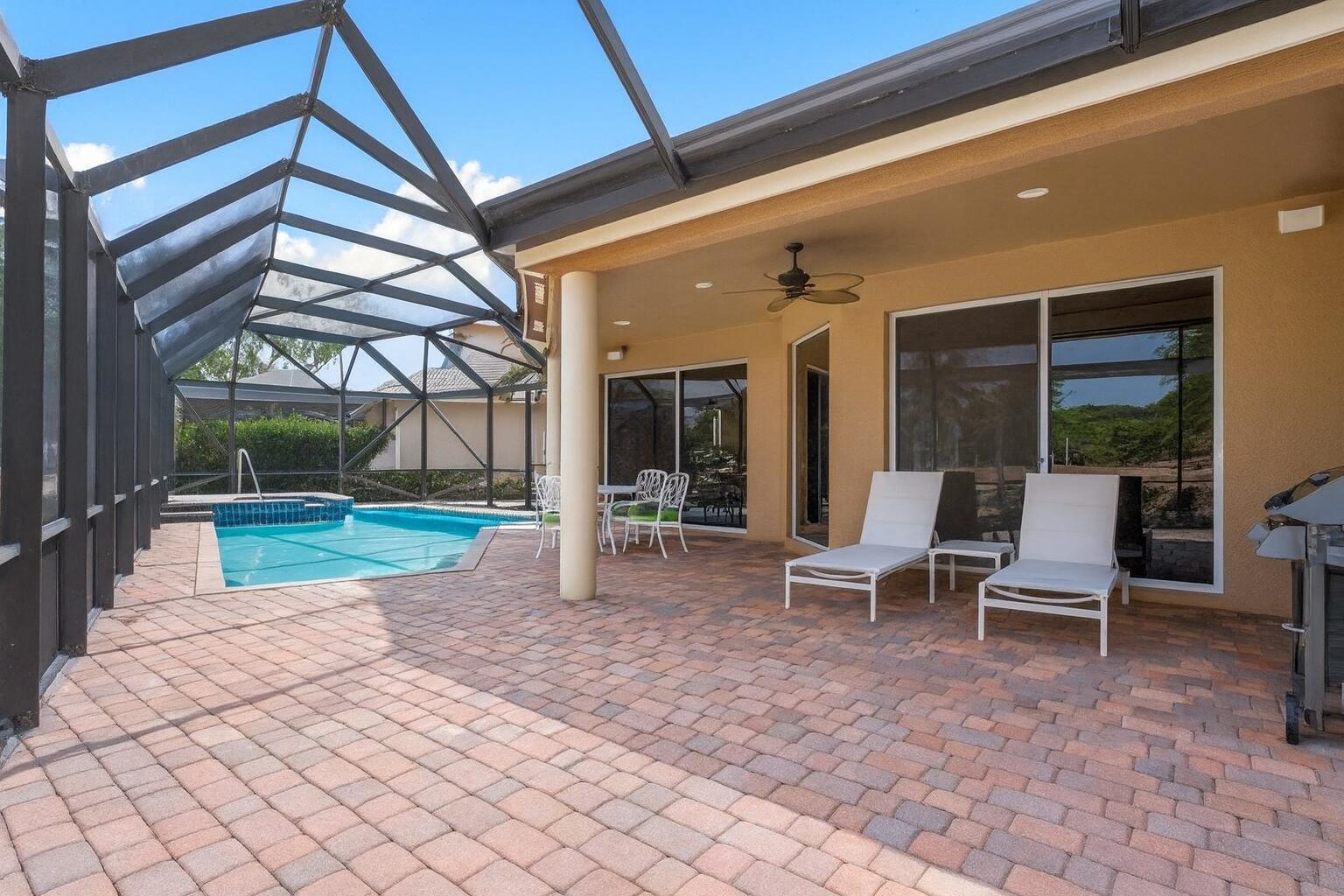 8161 Quail Meadow Way West Palm Beach, FL 33412 - Photo 21 of 36 a view of a house with backyard porch and sitting area