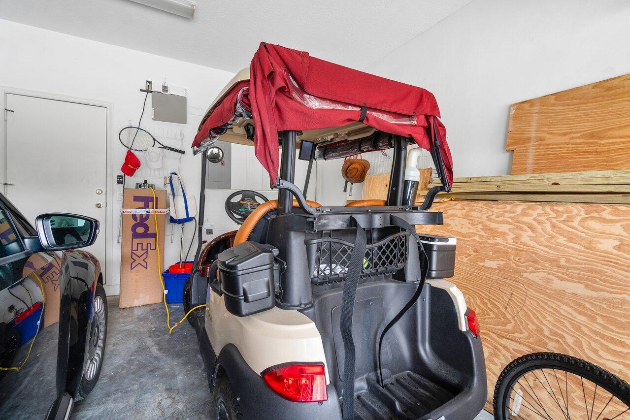 8161 Quail Meadow Way West Palm Beach, FL 33412 - Photo 23 of 36 a view of a room with gym equipment