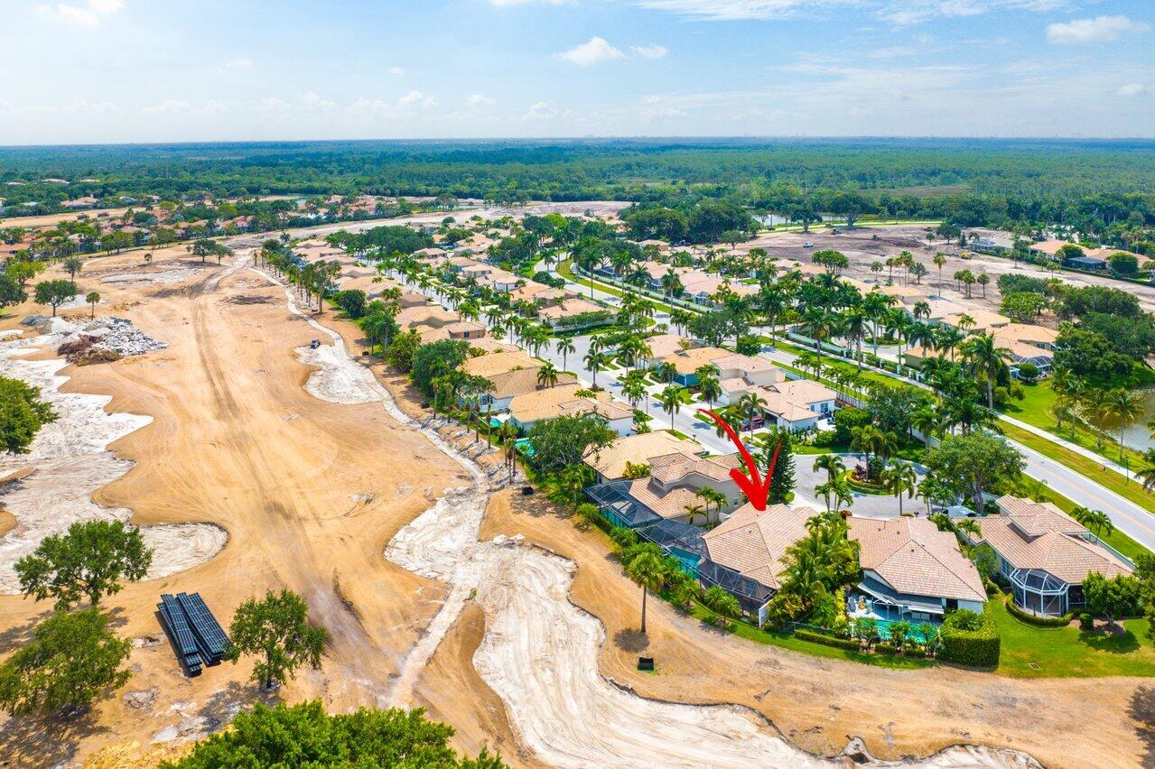 8161 Quail Meadow Way West Palm Beach, FL 33412 - Photo 25 of 36 an aerial view of residential houses with outdoor space and trees