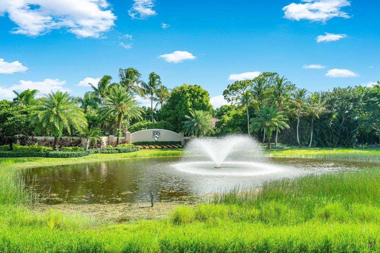 8161 Quail Meadow Way West Palm Beach, FL 33412 - Photo 32 of 36 a view of a golf course with a lake