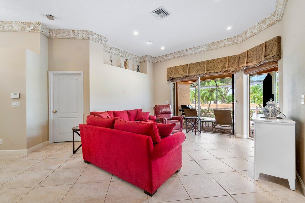 8161 Quail Meadow Way West Palm Beach, FL 33412 - Photo 5 of 36 a living room with furniture and a large window