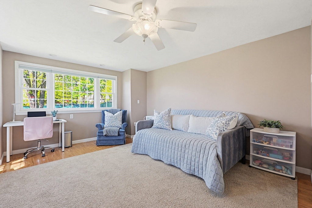 18 Anchorage Road Franklin, MA 02038 - Photo 23 of 42 a bedroom with a bed and a chandelier