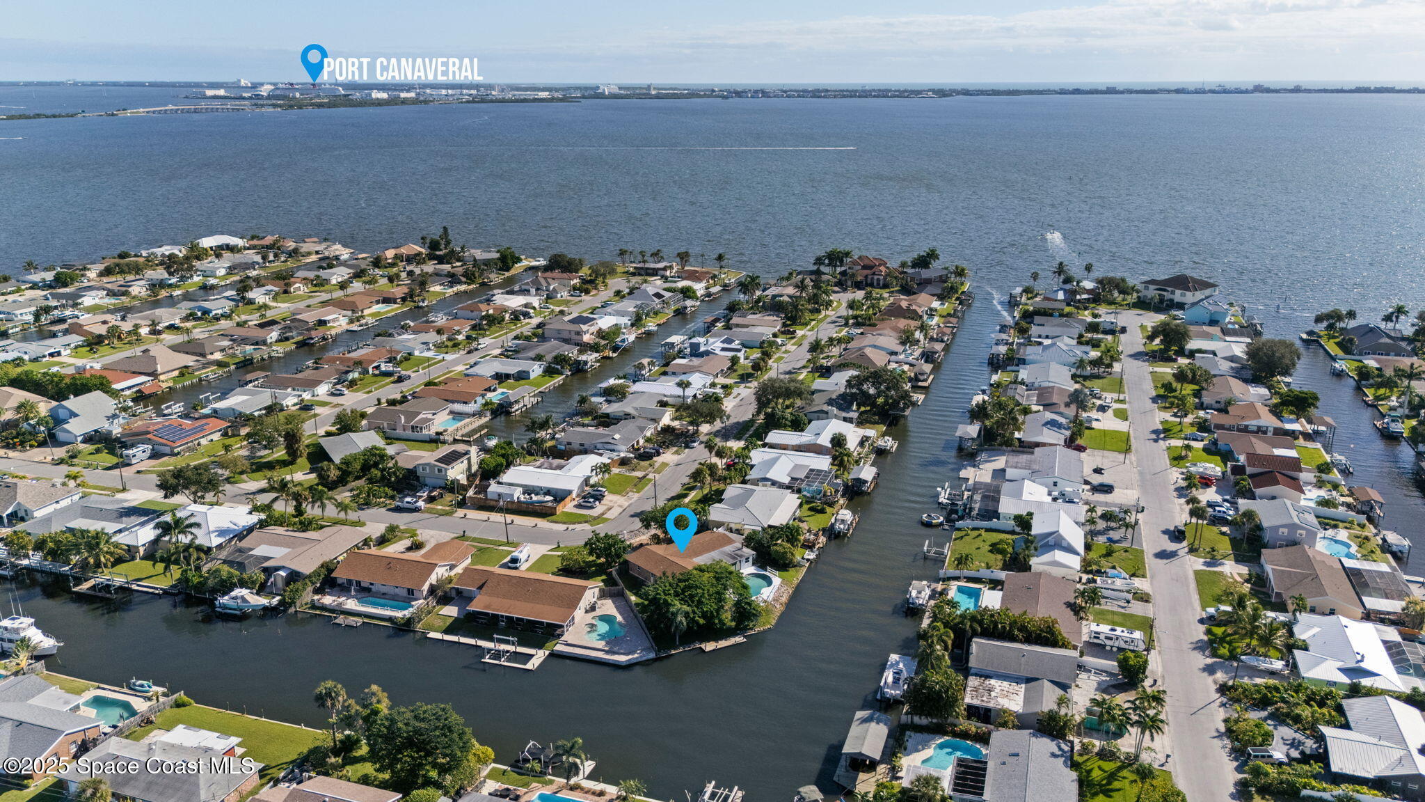 an aerial view of a houses with ocean view