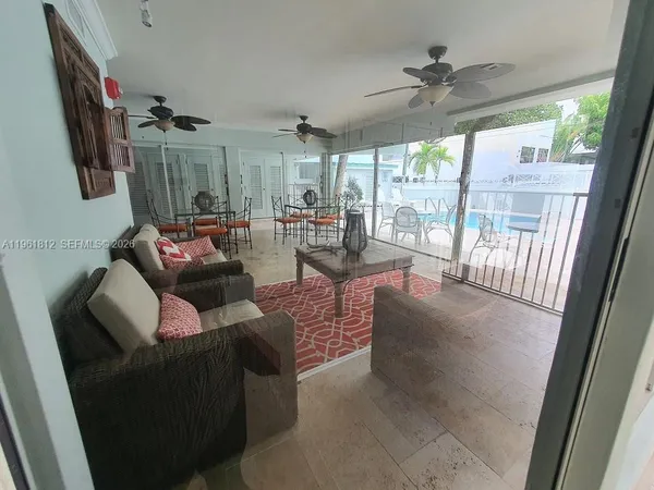 a view of a swimming pool with chairs