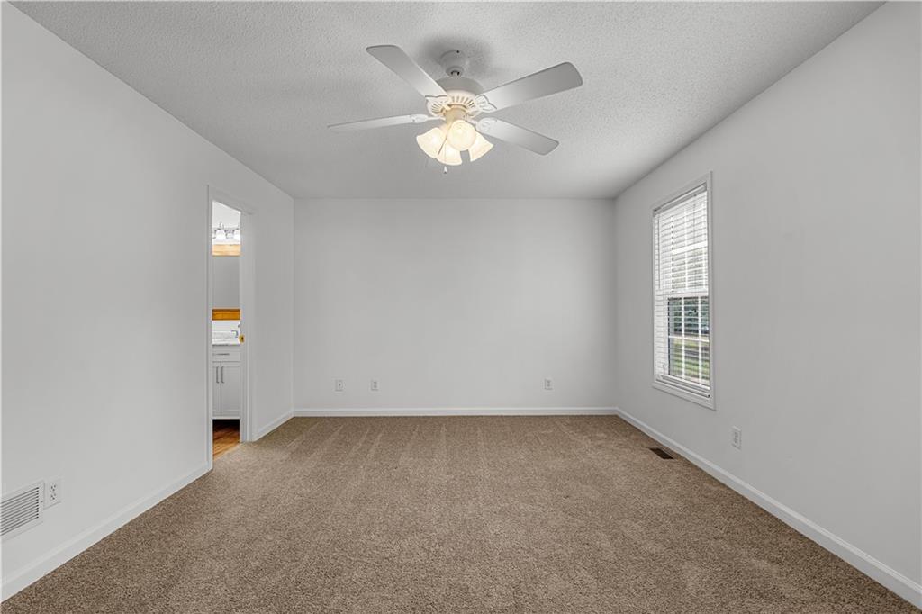 3048 Turner Church Road McDonough, GA 30252 - Photo 19 of 57 wooden floor in an empty room with a window