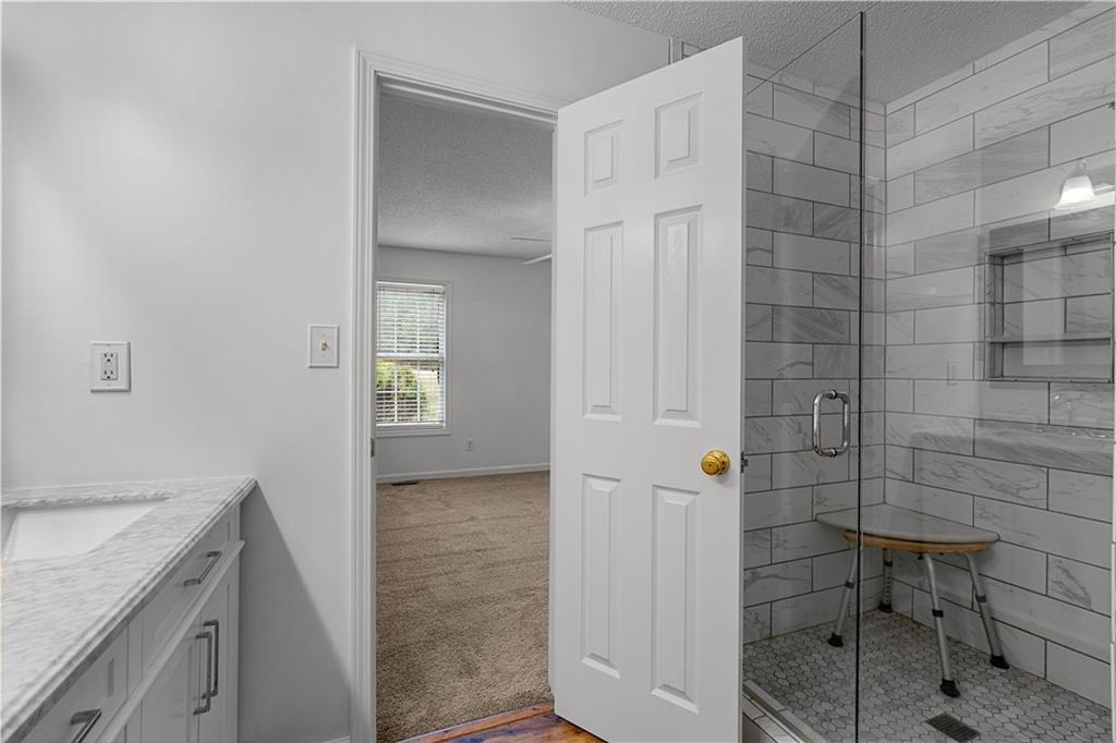 3048 Turner Church Road McDonough, GA 30252 - Photo 23 of 57 a bathroom with a shower and a sink
