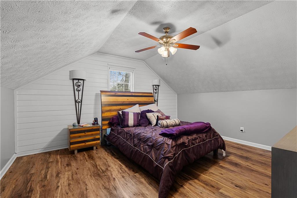 3048 Turner Church Road McDonough, GA 30252 - Photo 32 of 57 a bedroom with a bed and a chandelier