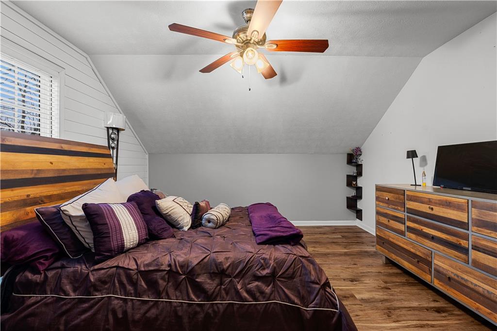 3048 Turner Church Road McDonough, GA 30252 - Photo 34 of 57 a bedroom with a bed and wooden floor