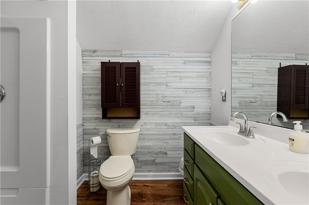 3048 Turner Church Road McDonough, GA 30252 - Photo 36 of 57 a bathroom with a sink toilet and mirror