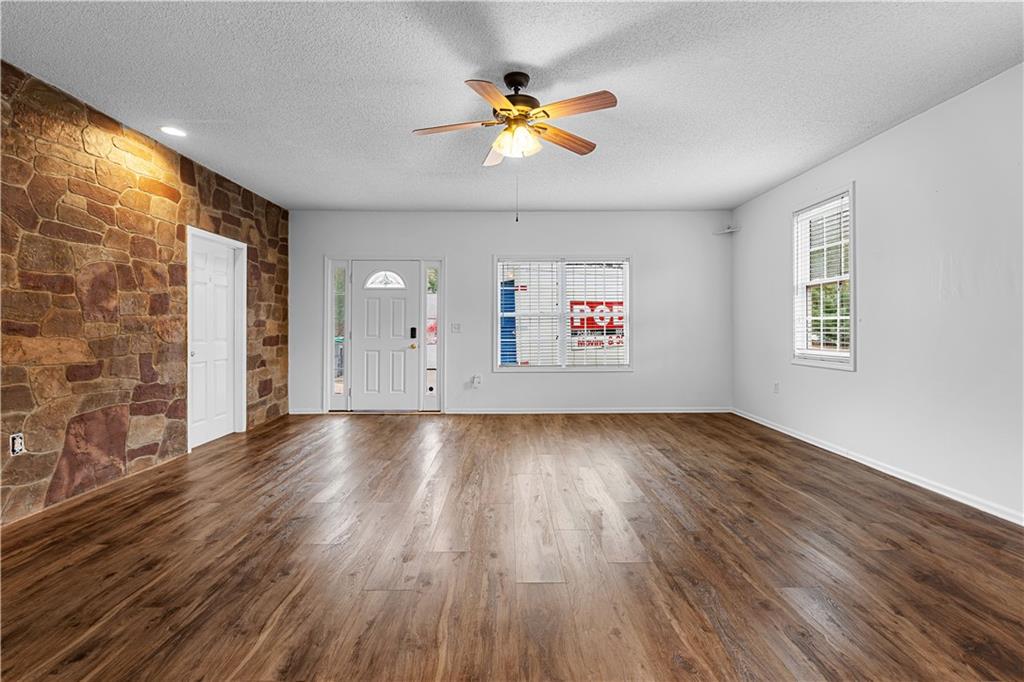 3048 Turner Church Road McDonough, GA 30252 - Photo 39 of 57 an empty room with wooden floor and windows