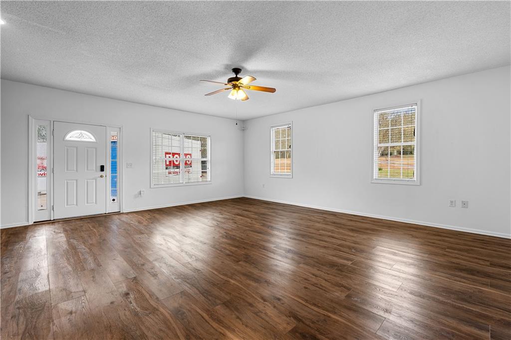 3048 Turner Church Road McDonough, GA 30252 - Photo 40 of 57 an empty room with wooden floor and windows