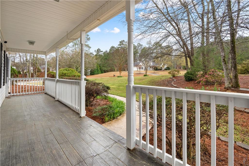 3048 Turner Church Road McDonough, GA 30252 - Photo 4 of 57 a view of a porch with wooden floor and fence