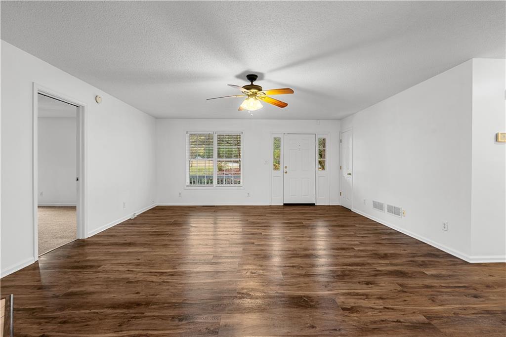 3048 Turner Church Road McDonough, GA 30252 - Photo 8 of 57 a view of an empty room with window and wooden floor