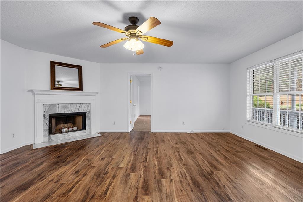 3048 Turner Church Road McDonough, GA 30252 - Photo 9 of 57 a view of empty room with wooden floor and fireplace