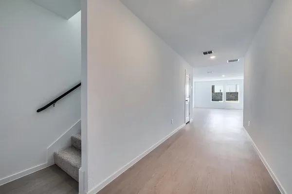 a view of hallway with stairs