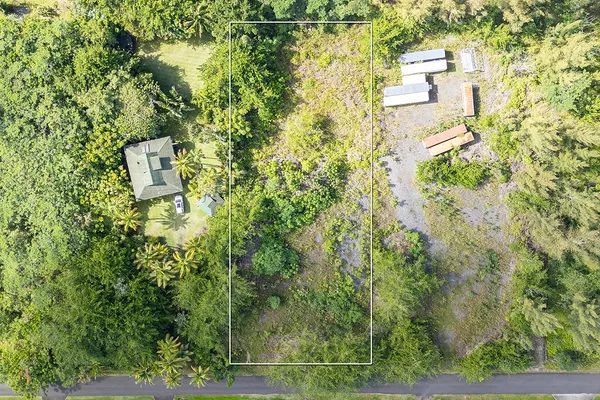 a aerial view of a residential apartment building with a yard