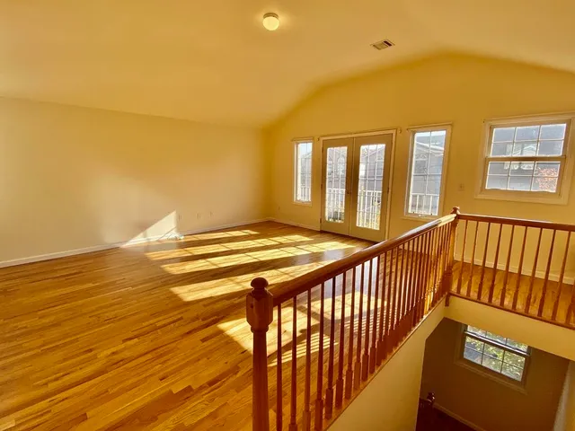 a view of balcony with floor to ceiling windows