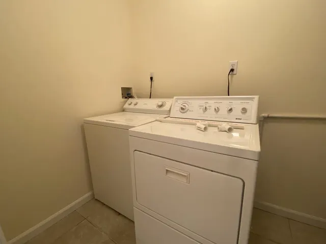 a bathroom with a sink toilet and mirror