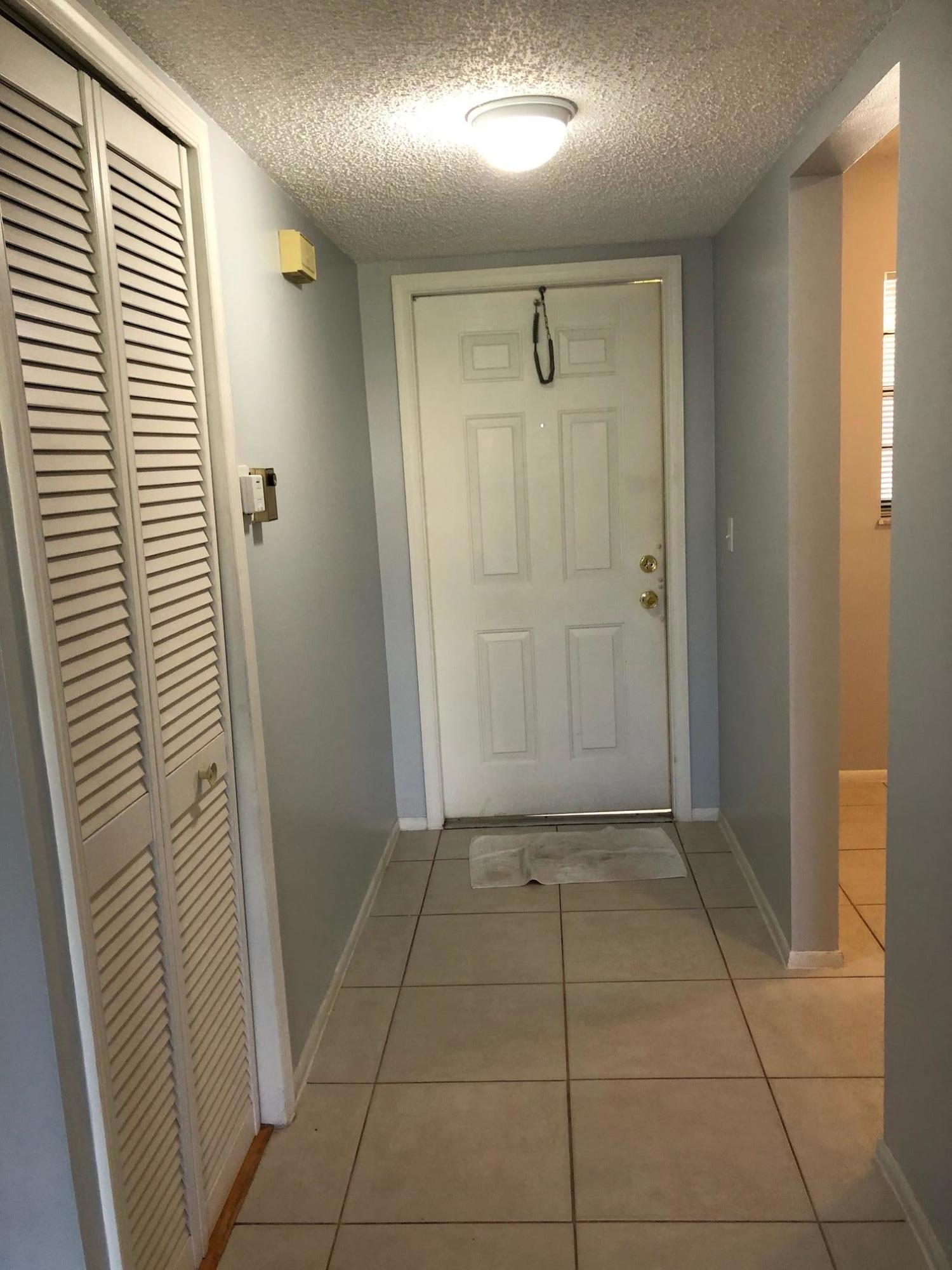 23398 Southwest 57th Avenue, Unit 305 Boca Raton, FL 33428 - Photo 3 of 14 Foyer