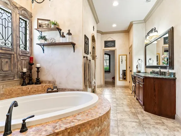 a bathroom with a granite countertop sink a mirror and a shower
