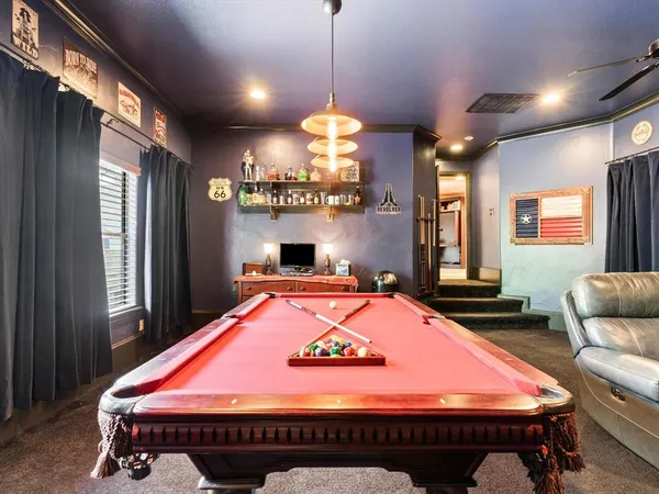a bedroom with furniture and a flat screen tv