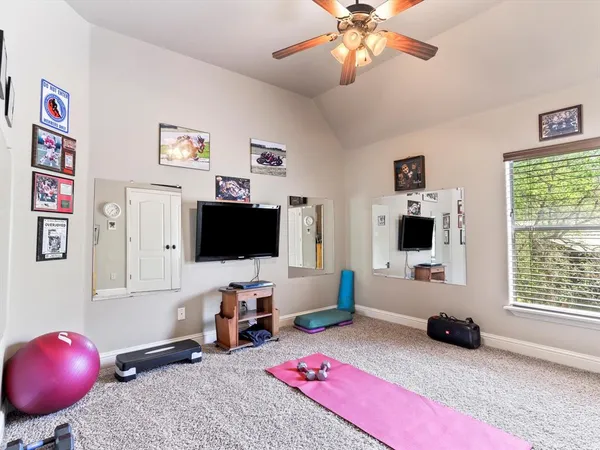 a view of a livingroom with workspace and a couch