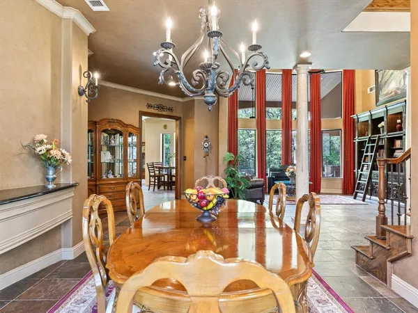 a living room filled with furniture and a potted plant