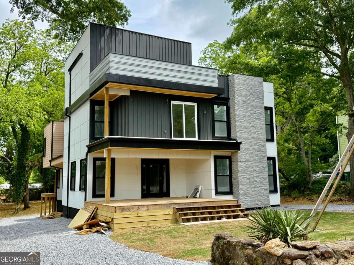1451 West Broad Street Athens, GA 30601 - Photo 11 of 21 a front view of a house with garden