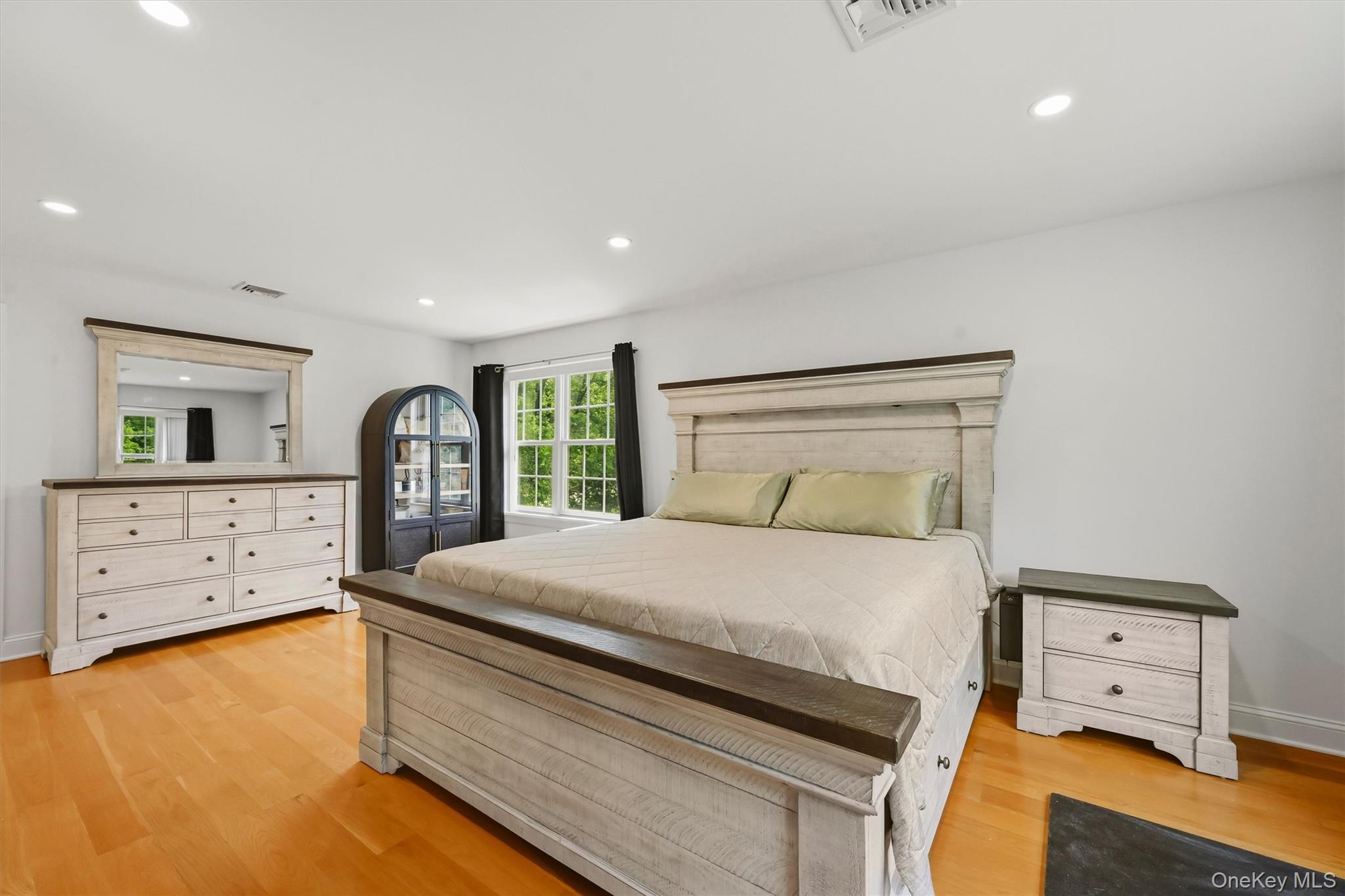 8 Darmstadter Road Bloomingburg, NY 12721 - Photo 23 of 47 15x19 Primary Bedroom with recessed lighting, wide oak flooring and balcony access.