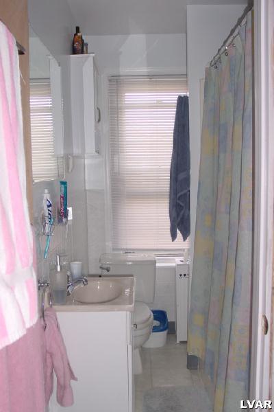 1641 Canal Street Northampton, PA 18067 - Photo 8 of 10 a bathroom with a sink and a mirror