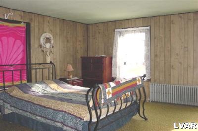 1641 Canal Street Northampton, PA 18067 - Photo 10 of 10 a bedroom with a bed and a table