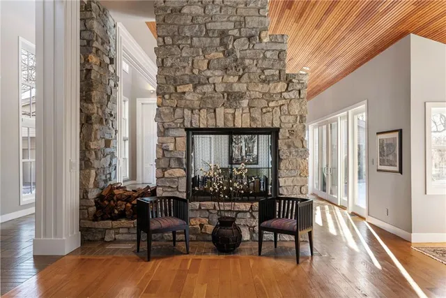 a dining room with furniture and wooden floor