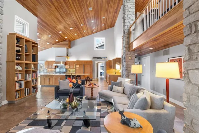 a living room filled with furniture and a table