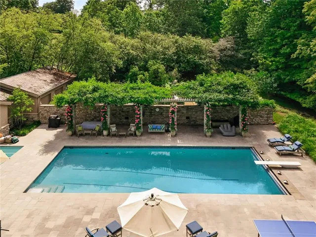 a view of a swimming pool with a patio