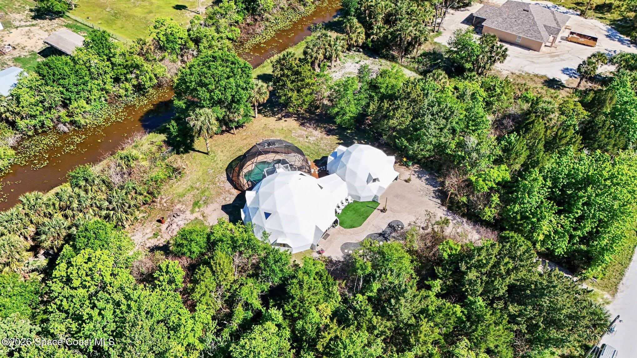 4045 Jake Avenue Cocoa, FL 32926 - Photo 35 of 35 an aerial view of a house with a yard and swimming pool