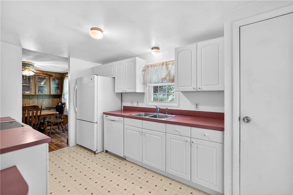 111 A Cowpath Road Aliquippa, PA 15001 - Photo 12 of 46 a kitchen with stainless steel appliances a refrigerator sink and cabinets
