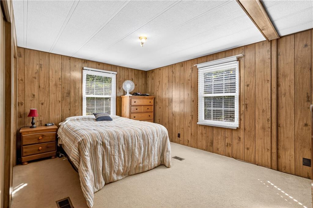 111 A Cowpath Road Aliquippa, PA 15001 - Photo 18 of 46 a bedroom with a large bed and a closet