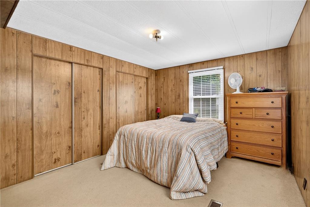 111 A Cowpath Road Aliquippa, PA 15001 - Photo 19 of 46 a bedroom with a bed and a dresser