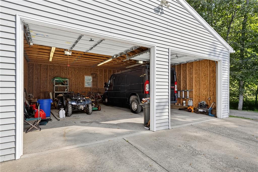 111 A Cowpath Road Aliquippa, PA 15001 - Photo 2 of 46 a view of a garage with parked cars