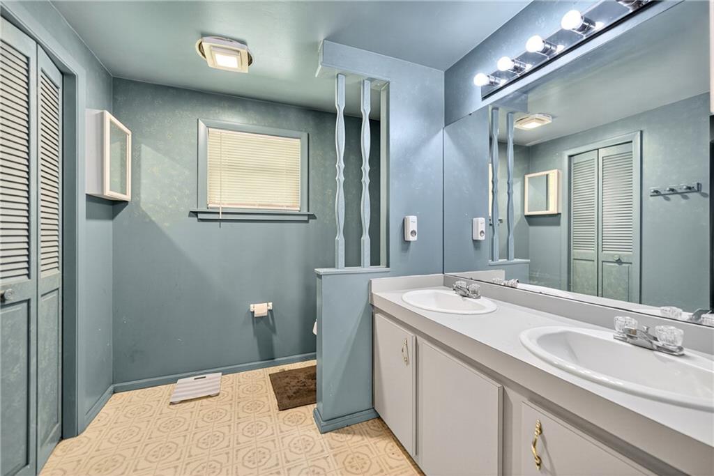 111 A Cowpath Road Aliquippa, PA 15001 - Photo 21 of 46 a bathroom with a sink and a mirror