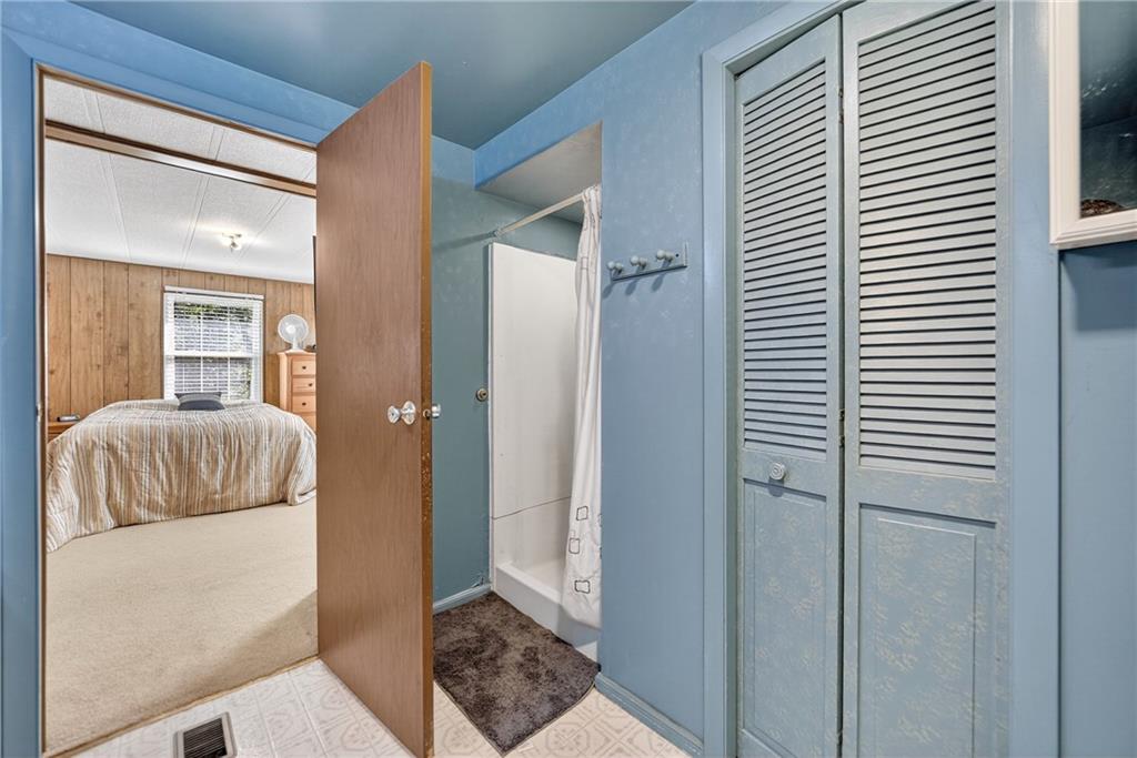 111 A Cowpath Road Aliquippa, PA 15001 - Photo 22 of 46 a bedroom with a bed and a window