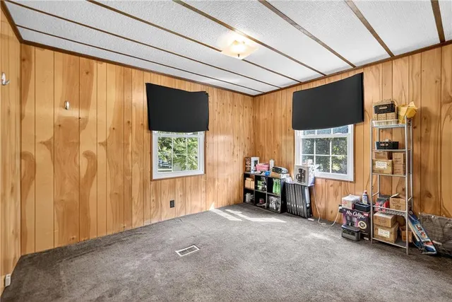 a view of a room with furniture and a large window
